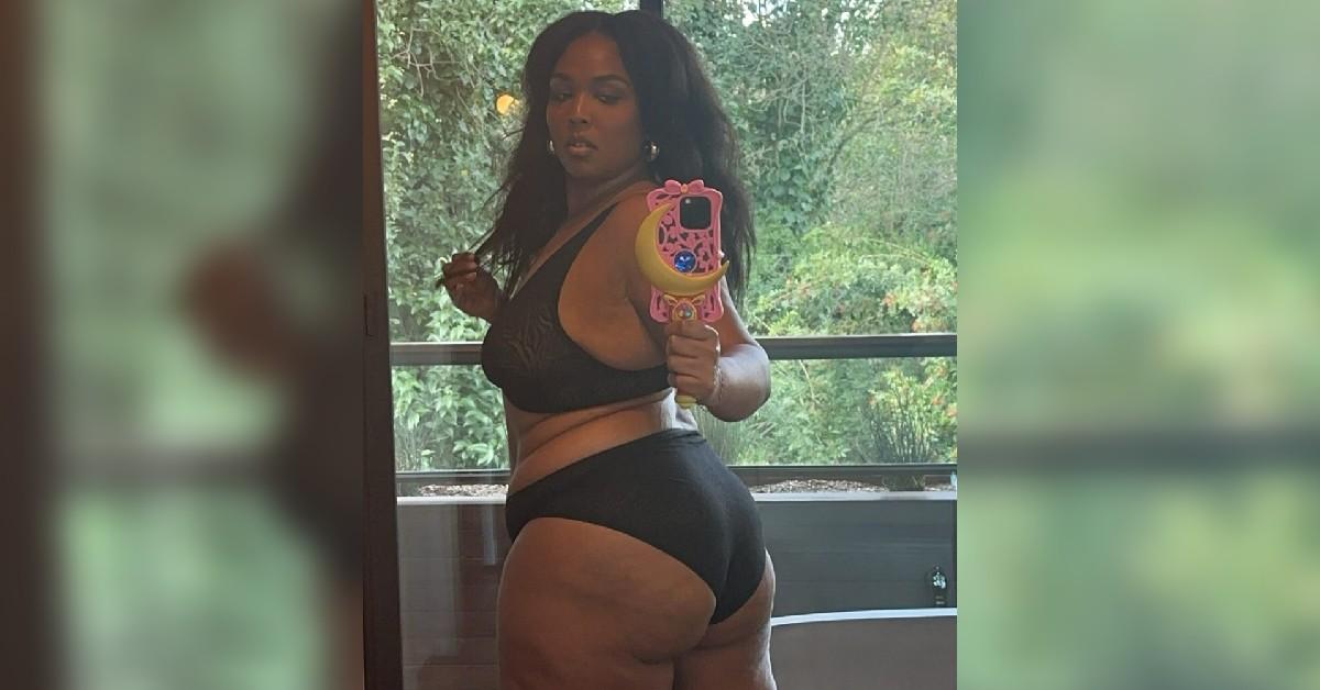 lizzo behind display black bra underwear weight loss journey photo