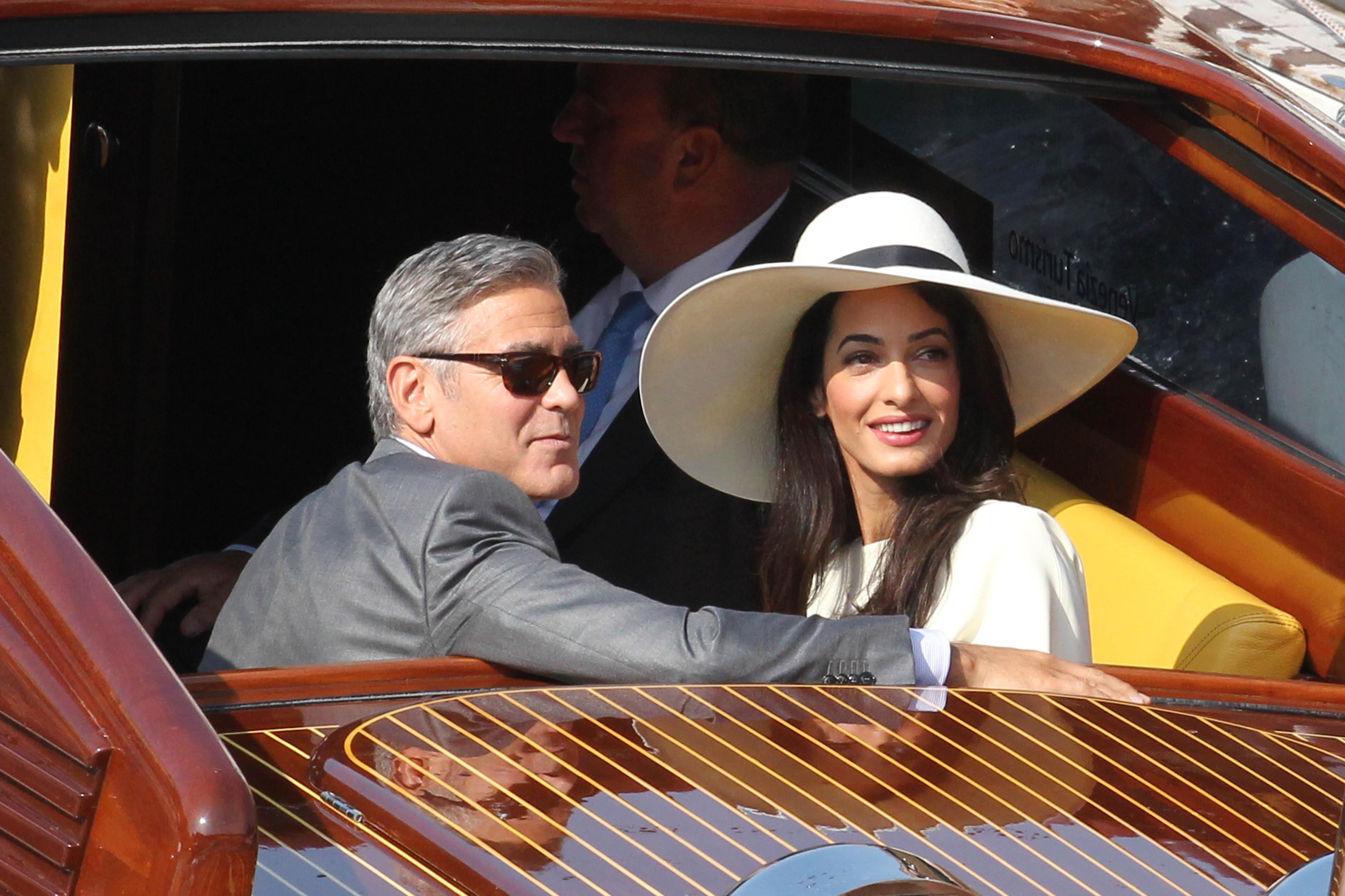 George Clooney and Amal Alamuddin on boat in Venice