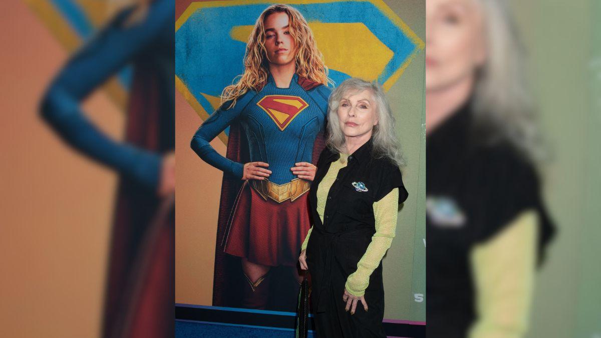 Image of Debbie Harry attended the 'Supergirl' premiere in a chic black jumpsuit.
