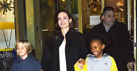 Angelina Jolie is all smiles with daughters Shiloh and Zahara while exiting Lee’s Art Shop in NYC