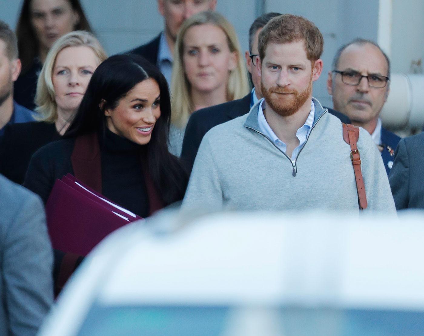 Prince Harry and his wife Meghan Markle pictured arriving in Sydney.