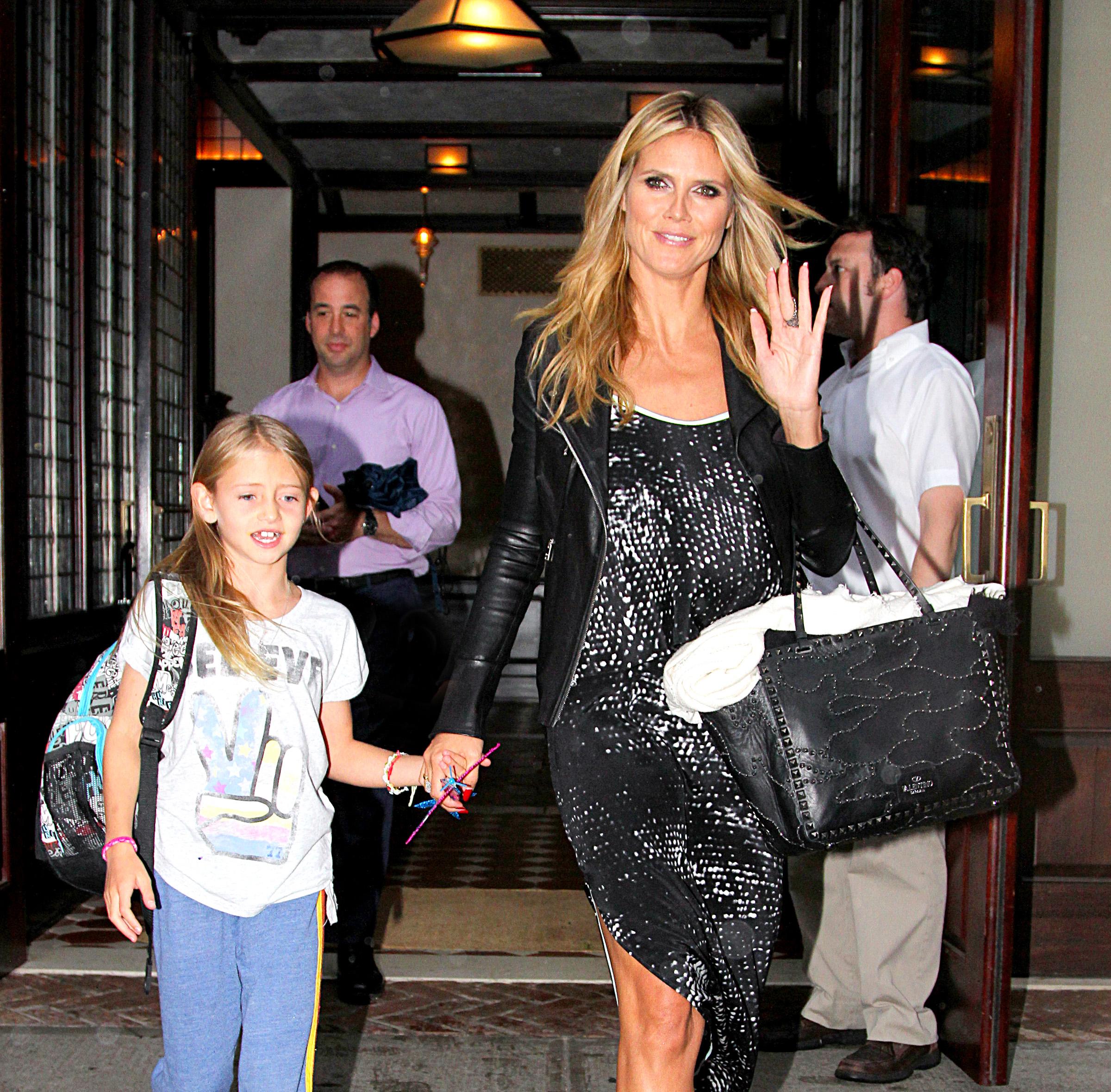 Heidi Klum is all smiles while leaving her NYC hotel with her family