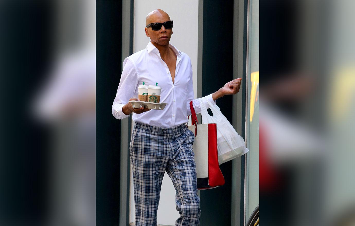 RuPaul walks the streets of Manhattan like its a runway while multitasking in NYC