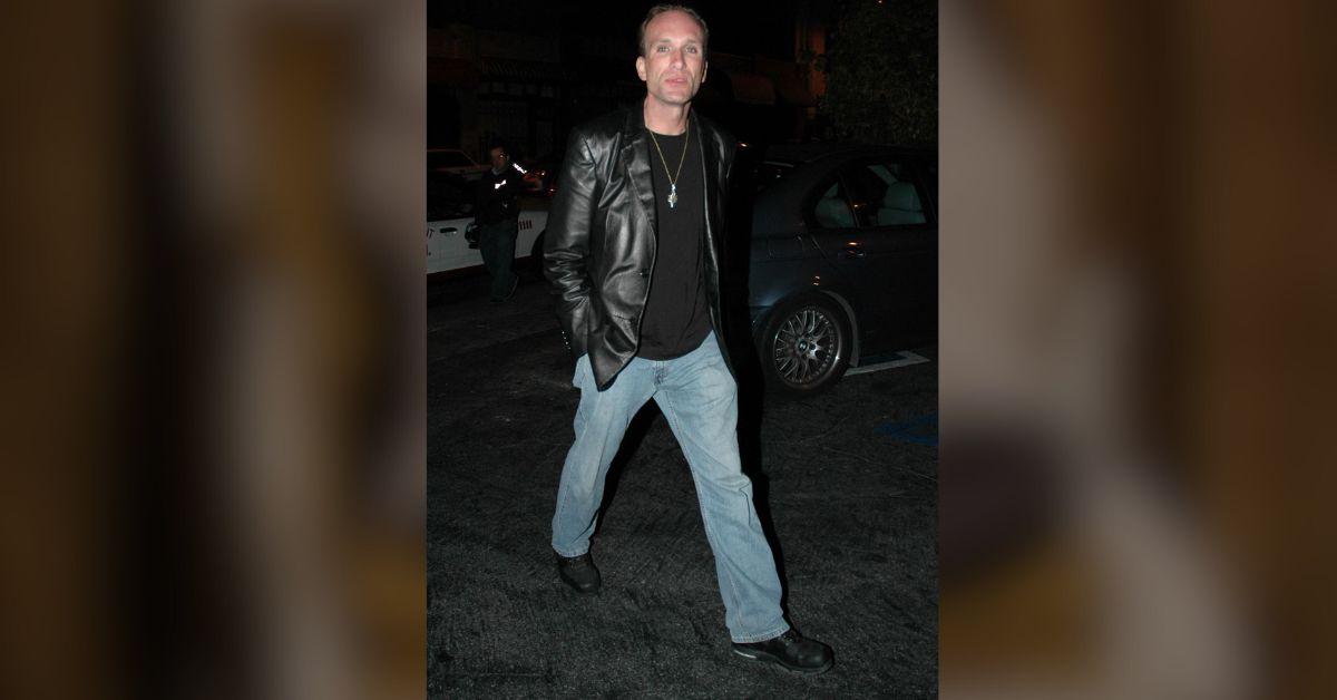 image of His neighbor alleged that his body was discovered facedown on the floor.