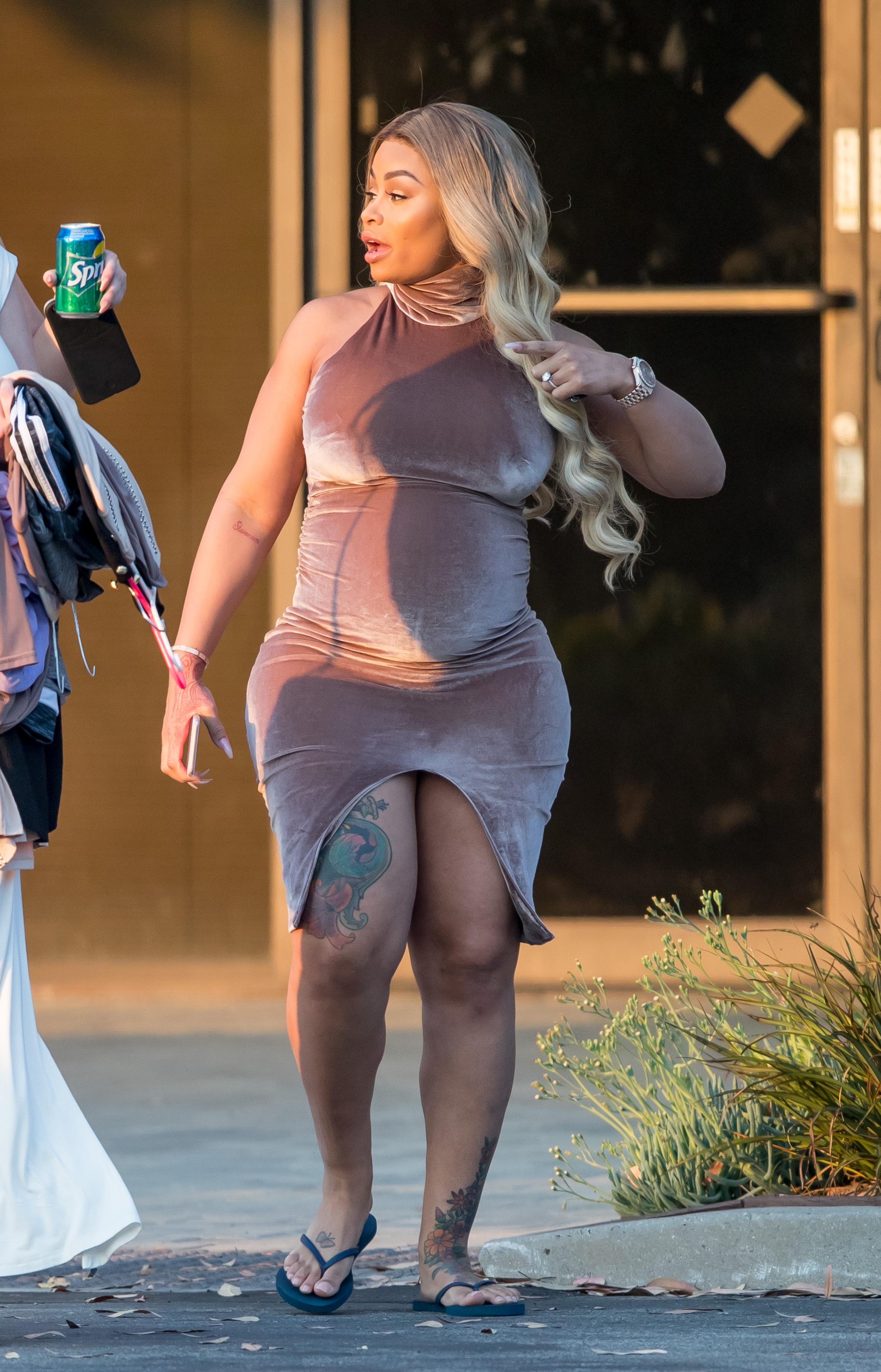 EXCLUSIVE: Pregnant Blac Chyna shows her curves in a  tight dress while out with friends in Los Angeles