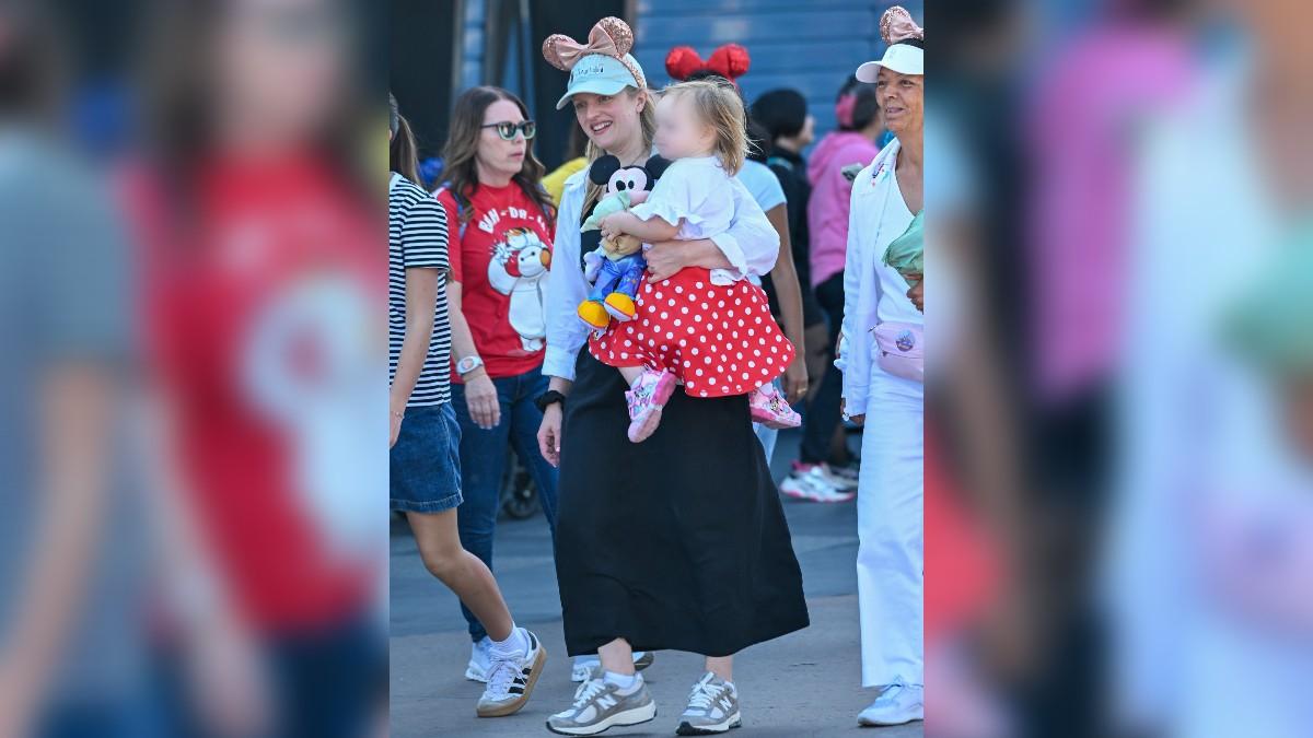 Image of Elisabeth Moss and her daughter wore matching Minnie Mouse ears.