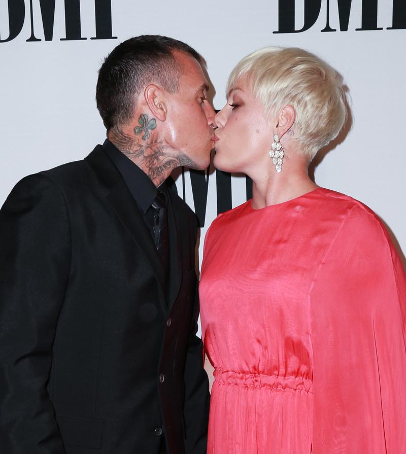 Singer P!nk and husband Carey Hart kiss on the 63rd Annual BMI Pop Awards  red carpet