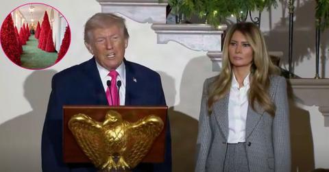 composite photo of donald trump and melania trump and red christmas trees at the white house