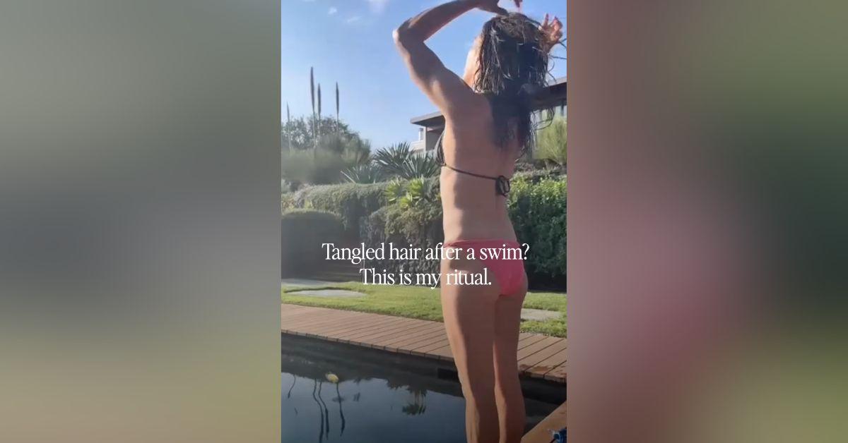 Image of Jennifer Aniston stripped down to a skimpy bikini by the pool.