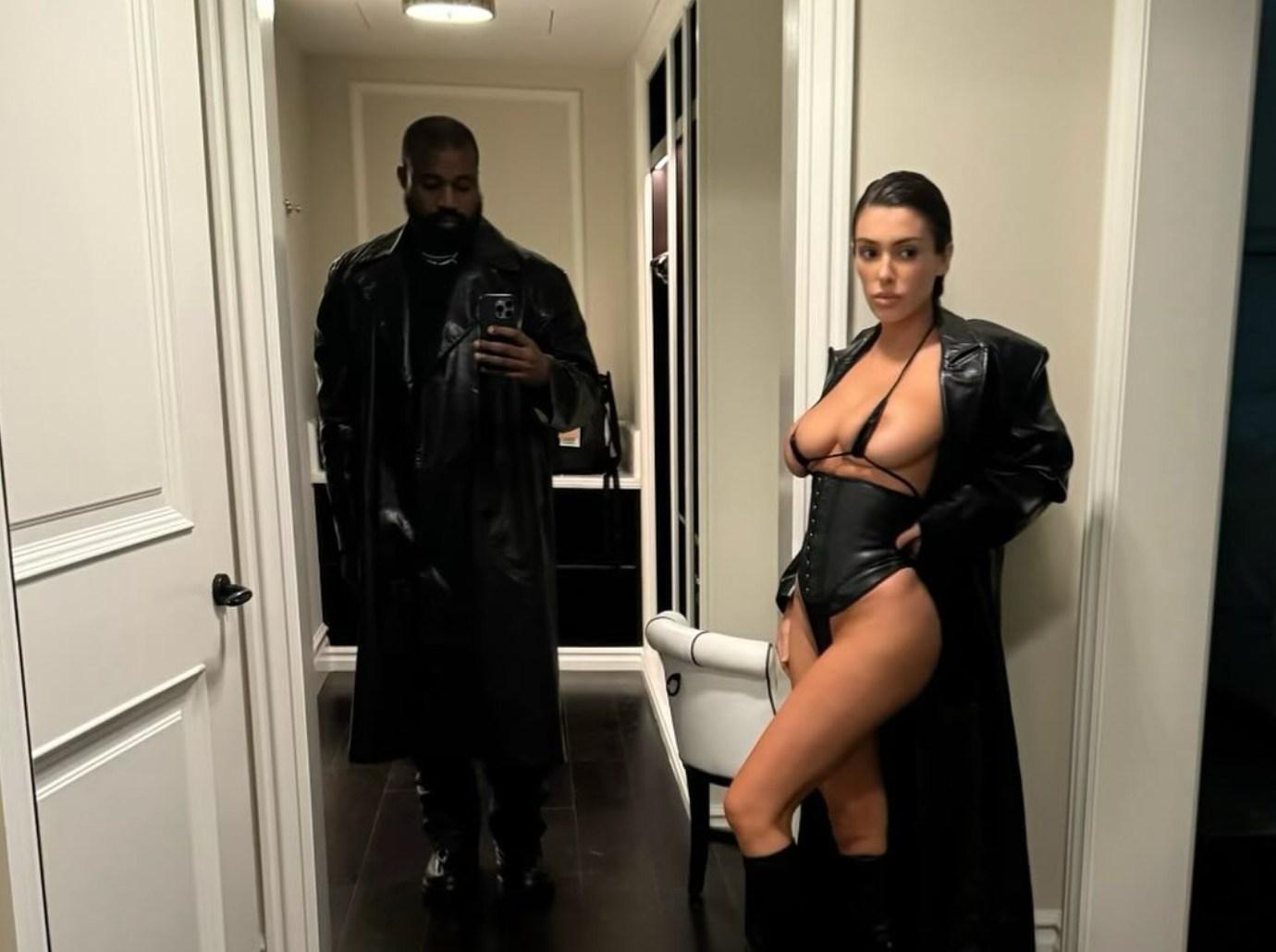 kanye wests wife bianca censori photo titanium teeth phone background