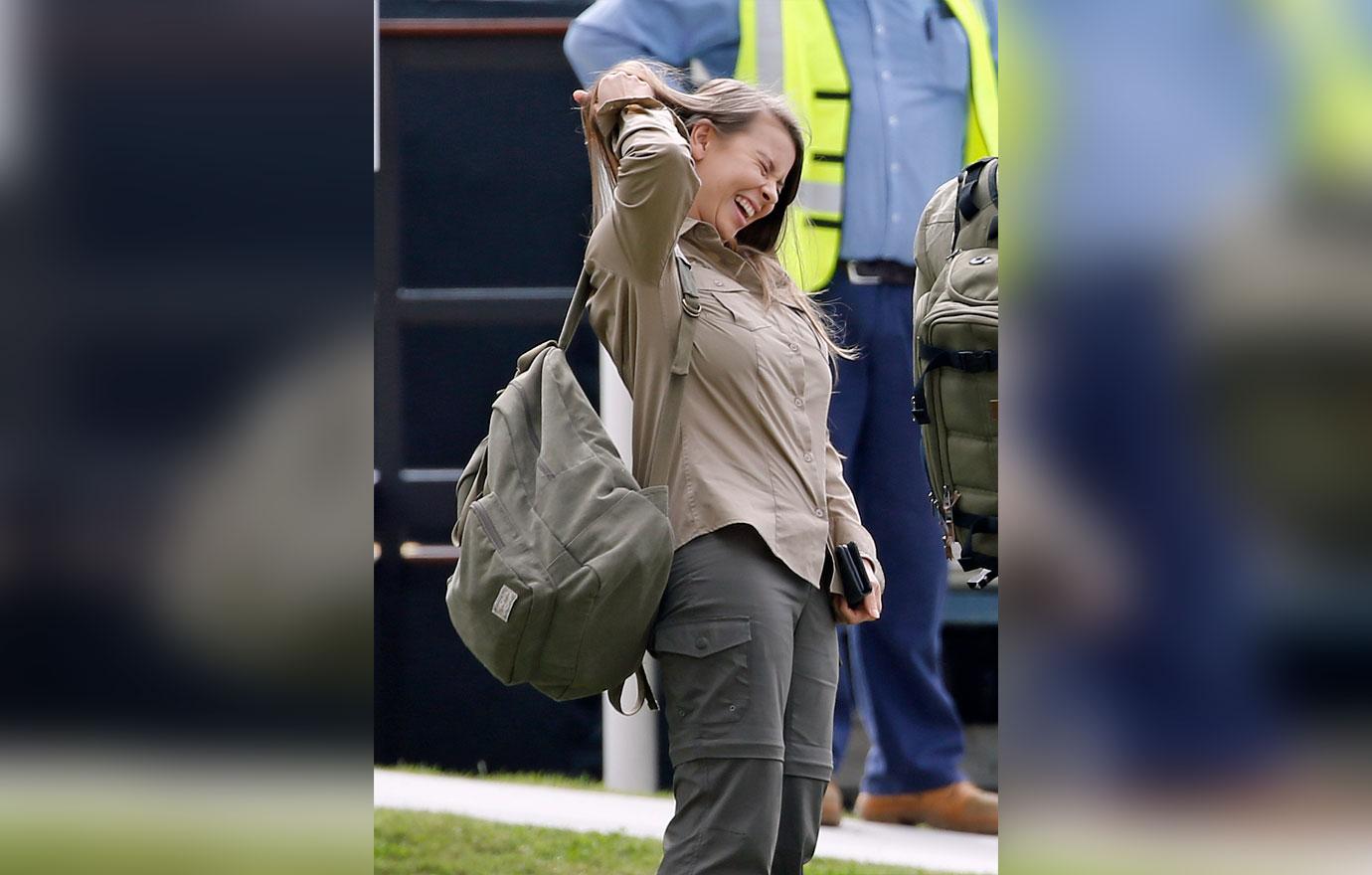 Pregnant Bindi Irwin and Chandler Powell at airport on the anniversary of Steve Irwin's death