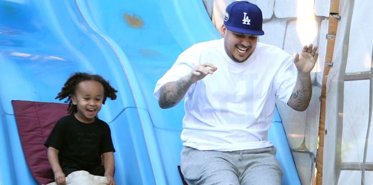 EXCLUSIVE: ***PREMIUM EXCLUSIVE RATES APPLY*** Rob Kardashian enjoys a day at Legoland with girlfriend Blac Chyna and rides a slide with her son King Cairo in LA