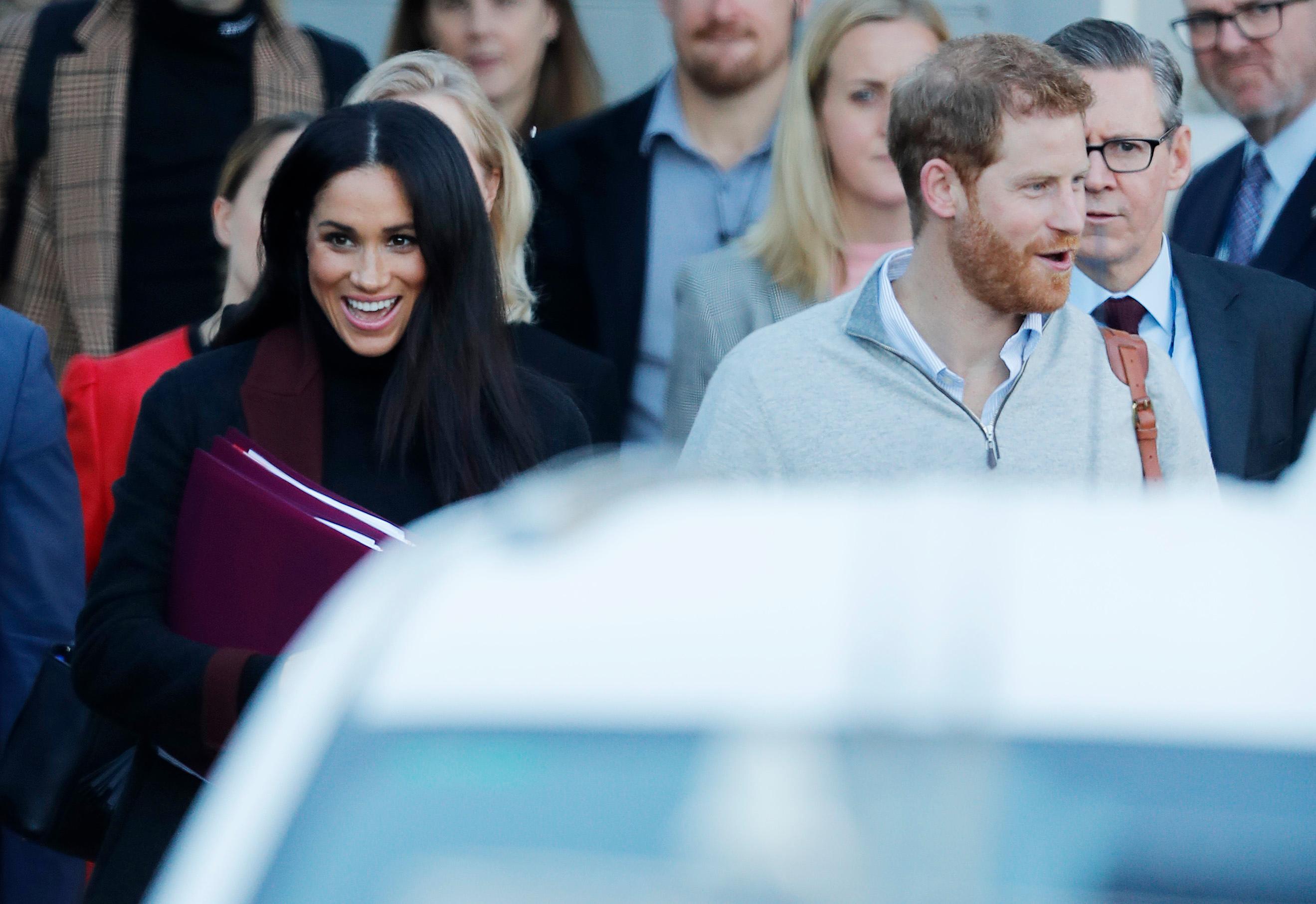 Prince Harry and his wife Meghan Markle pictured arriving in Sydney.