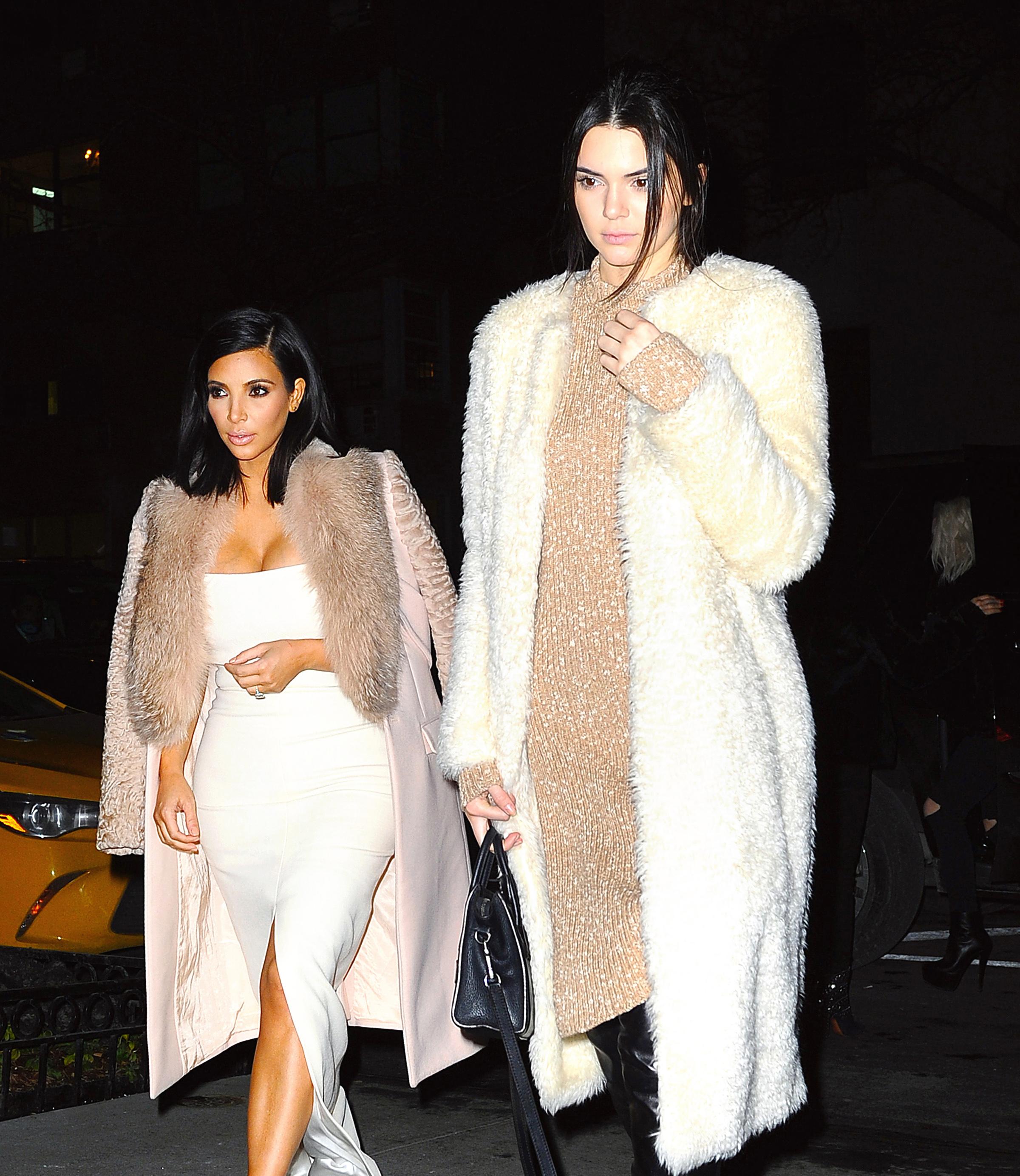 Kim Kardashian and Kendall Jenner dress up in matching white and beige outfits while out for dinner in NYC.