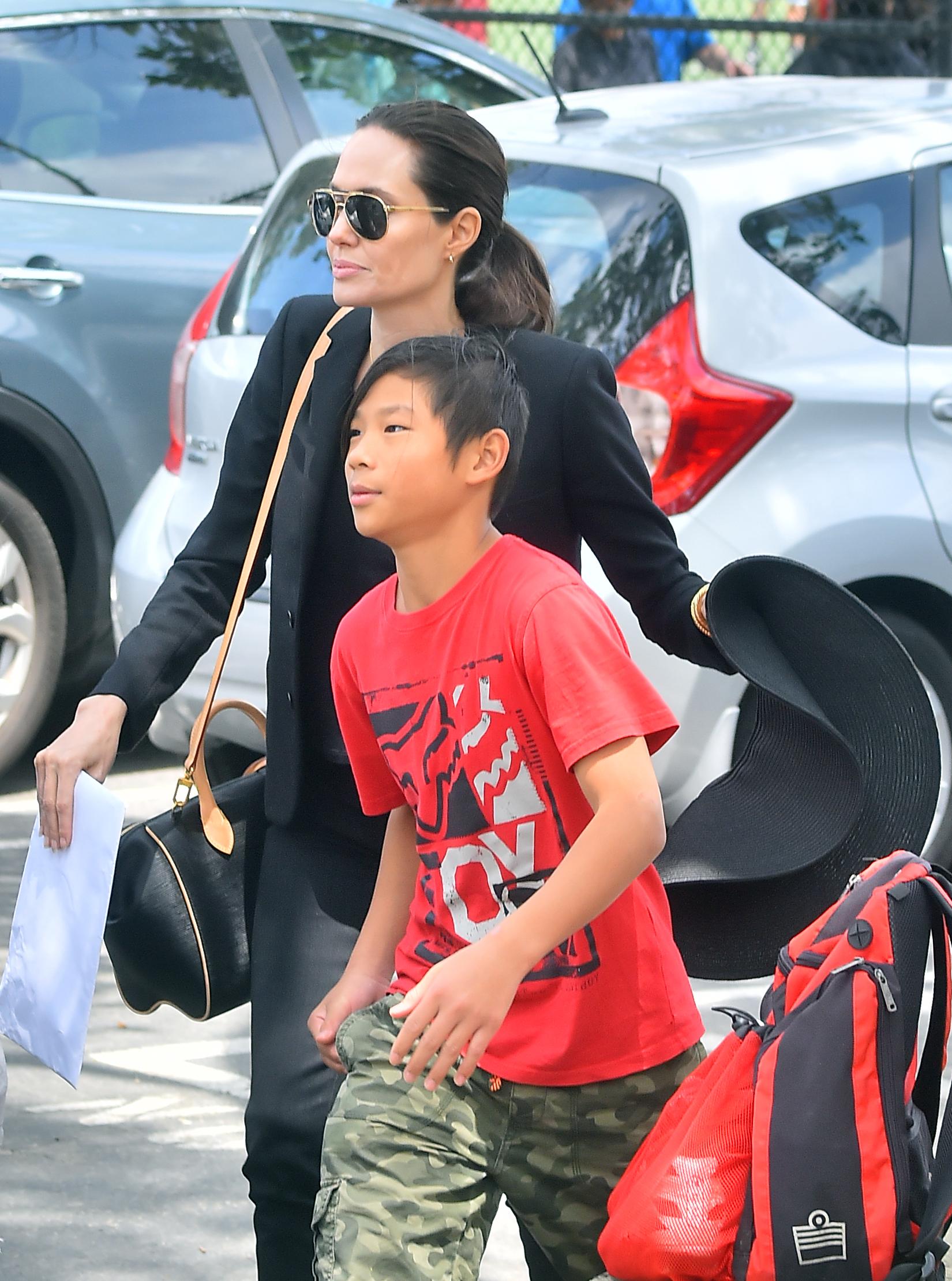 Angelina Jolie takes her boys Knox and Pax to visit her daughters Shiloh and Zahara&#8217;s soccer game