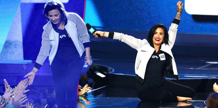 demi lovato falls onstage WE day