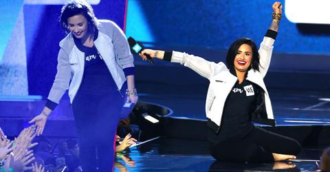 demi lovato falls onstage WE day