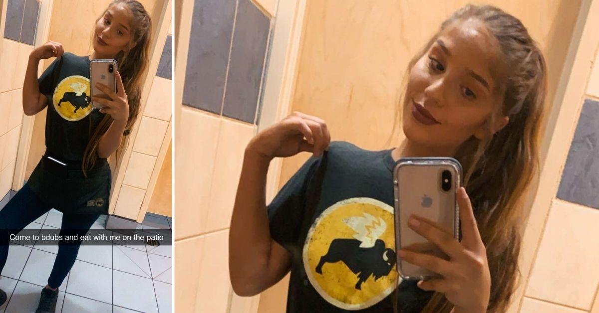 Genie Exum wearing her BWW uniform for a selfie on the job.