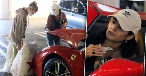 Vanessa Hudgens stuffs her Ferrari after early holiday shopping at the mall.
