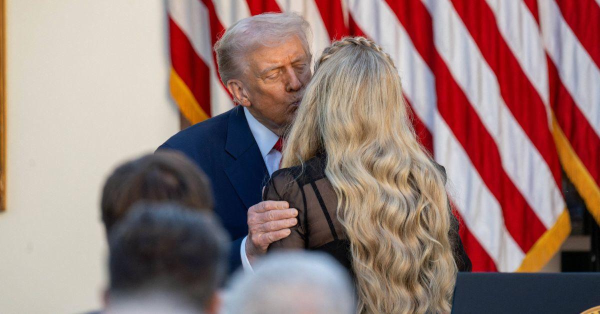 image of Donald Trump kissed Erika Kirk on the cheek when he presented her with her late husband's posthumous Medal of Freedom last month.