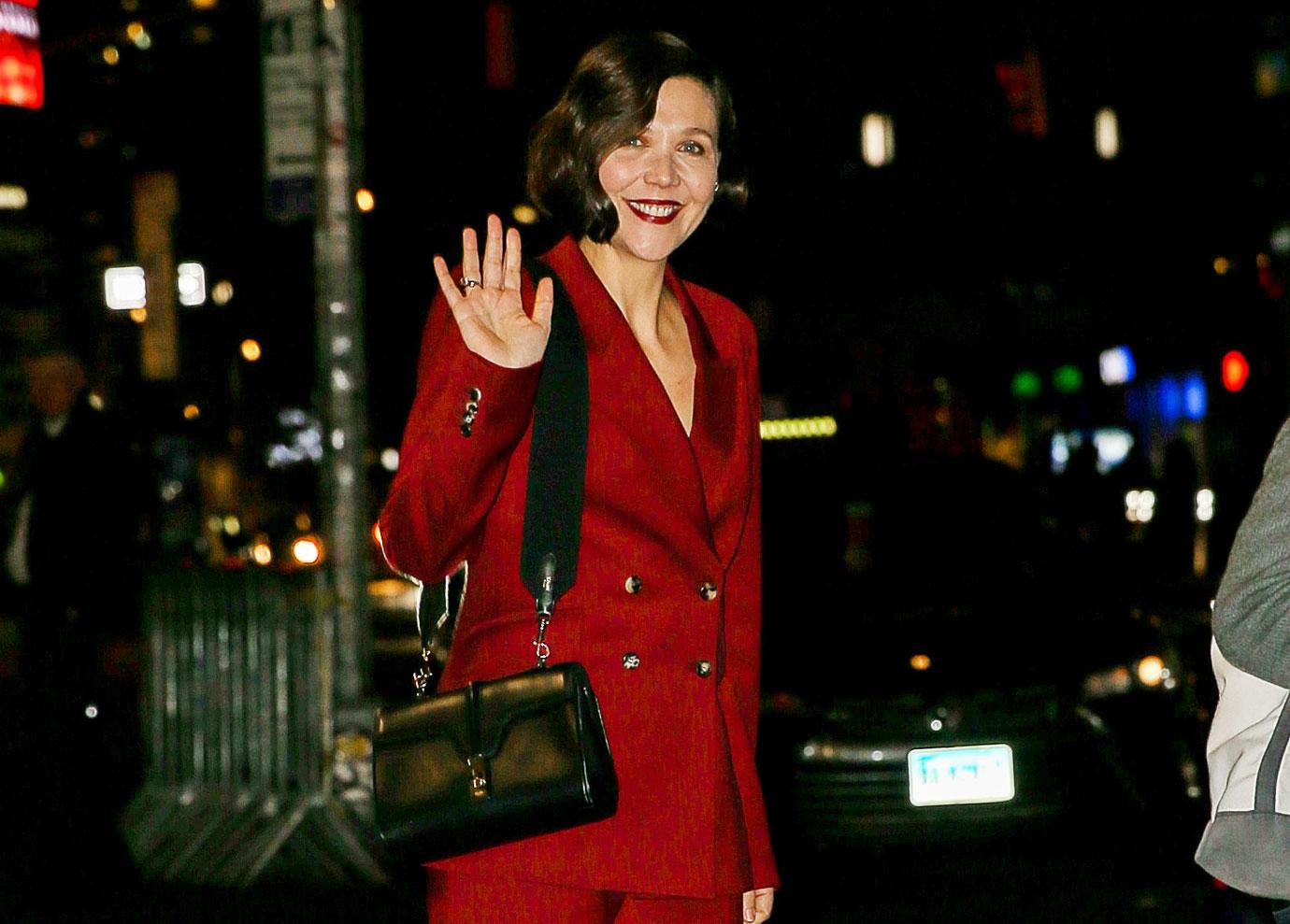 maggie gyllenhaal wears a red suit while leaving the late show with stephen colbert in nyc