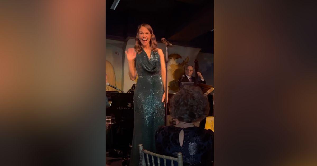 Image of Sutton Foster waved to Hugh Jackman in the audience.