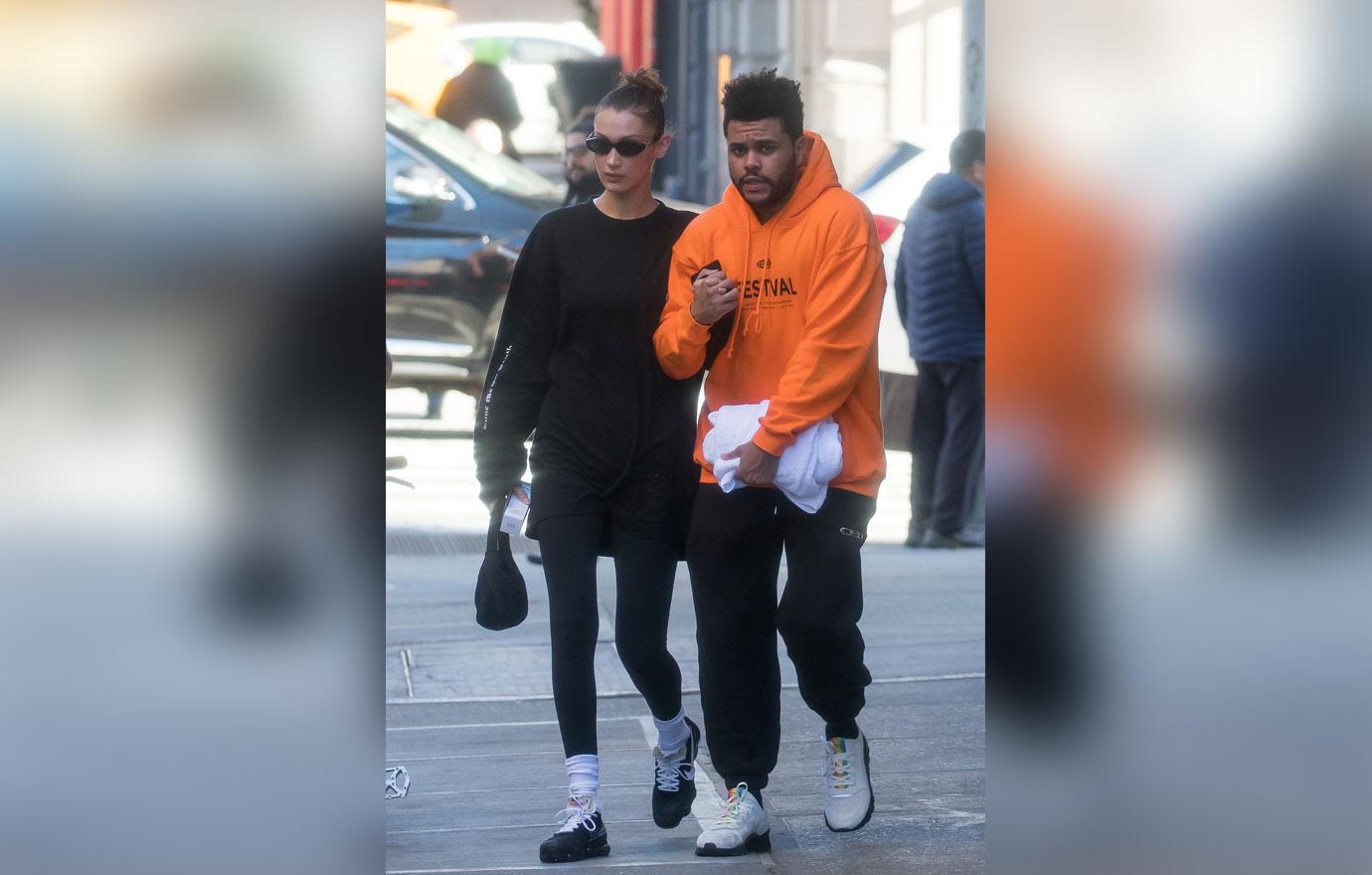 EXCLUSIVE: Bella Hadid and The Weeknd hold each other tight on a cold day in NYC