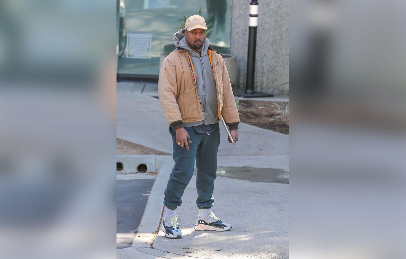 Kanye West greets our shutterbugs with open arms!