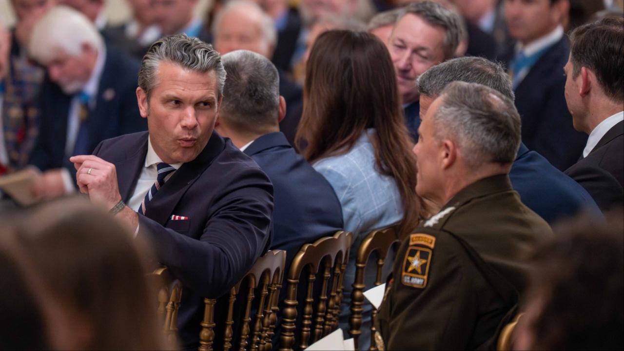Hegseth at a meeting