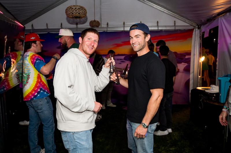 myles shear and chase crawford cheers with tequila don julio  mini bottles at palm tree music festival in lake tahoe on july