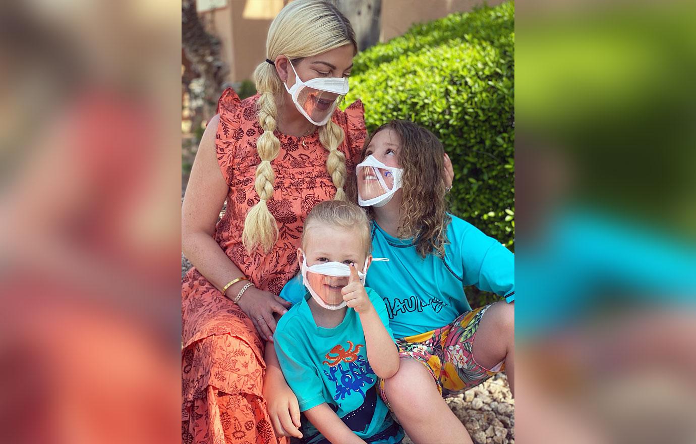 tori spelling and kids wearing bendshape masks