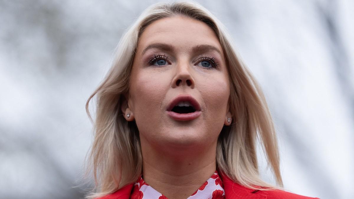 image of Karoline Leavitt praised Donald Trump at an event. 