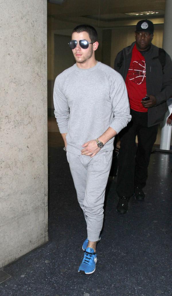 Nick Jonas arrives in Los Angeles as rumors about his relationship with Kate Hudson continue to swirl.