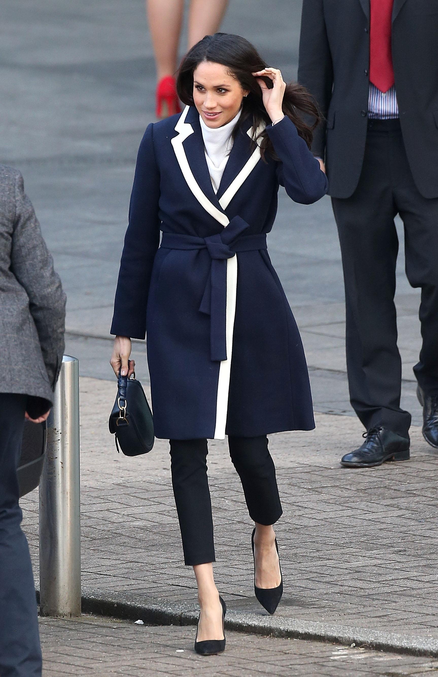 Prince Harry and Meghan Markle hold hands in Birmingham