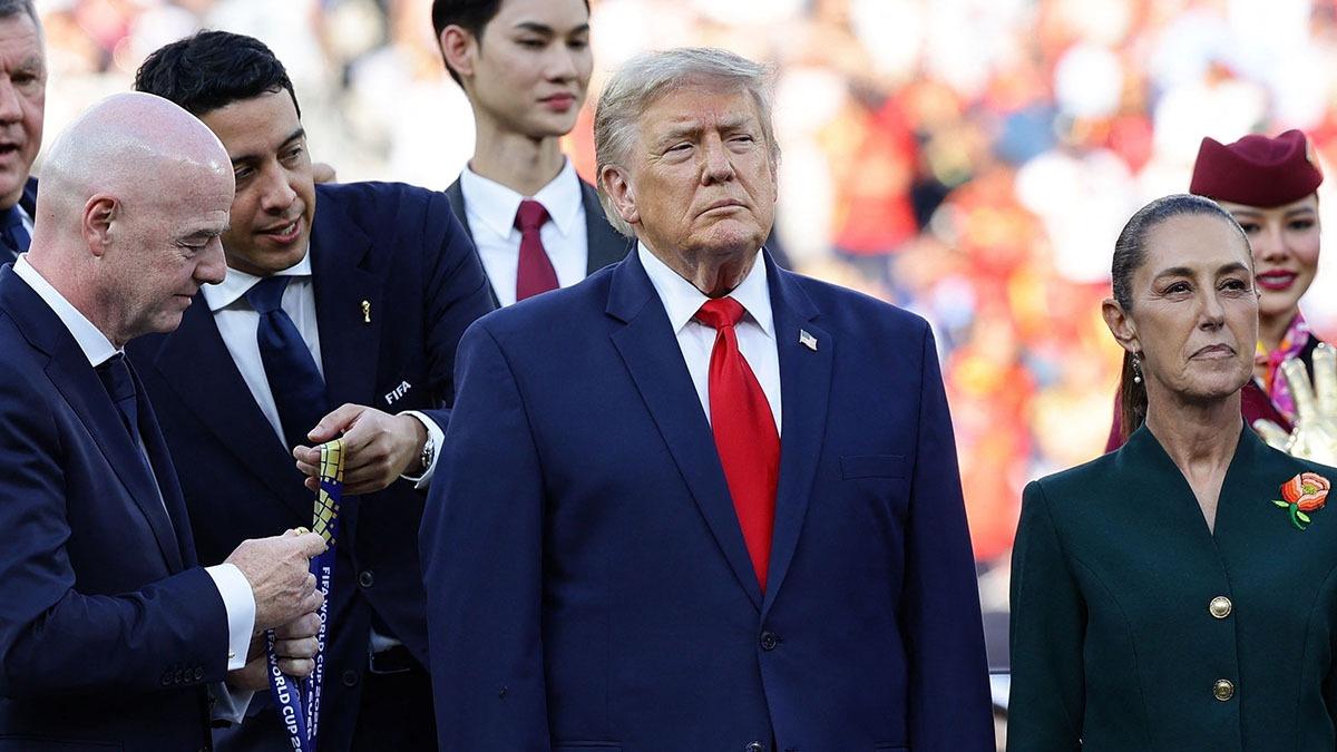 photo of The POTUS had to be guided away from the team's onstage celebration.