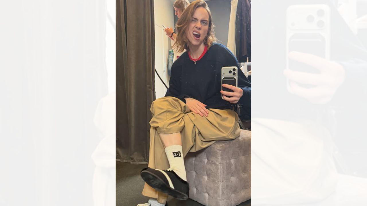 Image of Billie Eilish posed for a mirror selfie after lightening her hair.