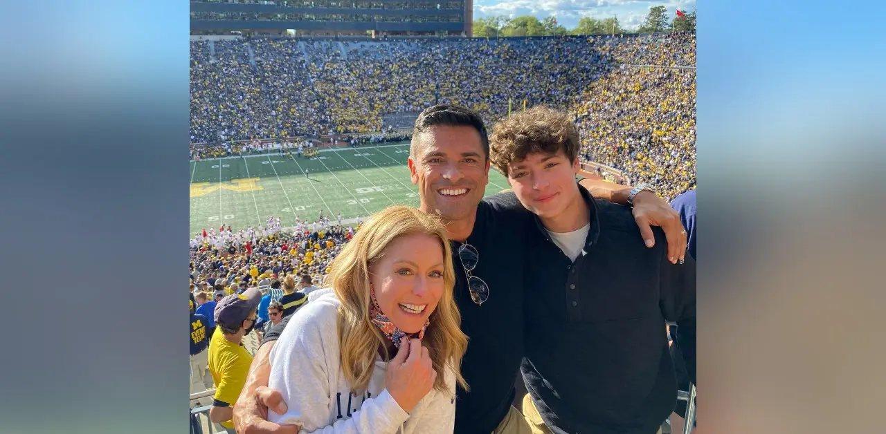 Photo of Kelly Ripa, Mark Consuelos and one of their sons