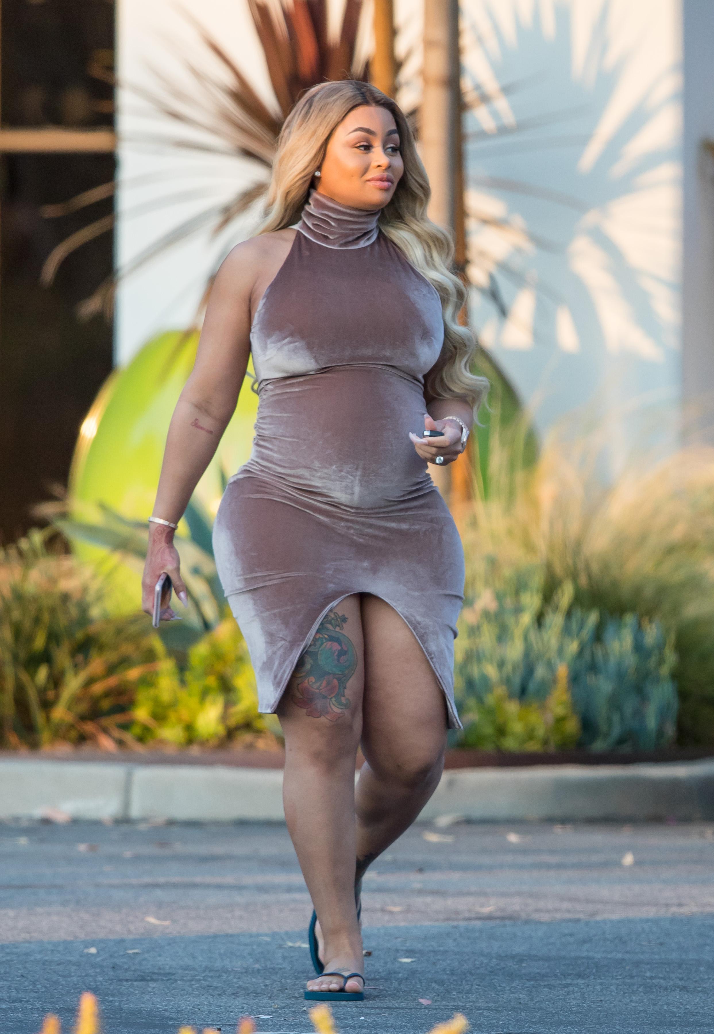 EXCLUSIVE: Pregnant Blac Chyna shows her curves in a  tight dress while out with friends in Los Angeles