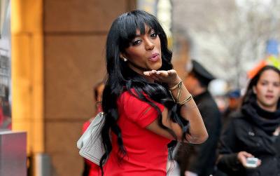 Porsha Williams spotted in a plunging red dress while blowing kisses to the paparazzi in New York City
