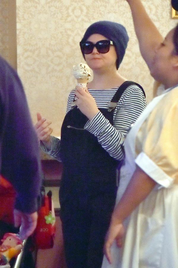 EXCLUSIVE: Pregnant Ginnifer Goodwin and her husband Josh Dallas share some sweet PDA at Disneyland