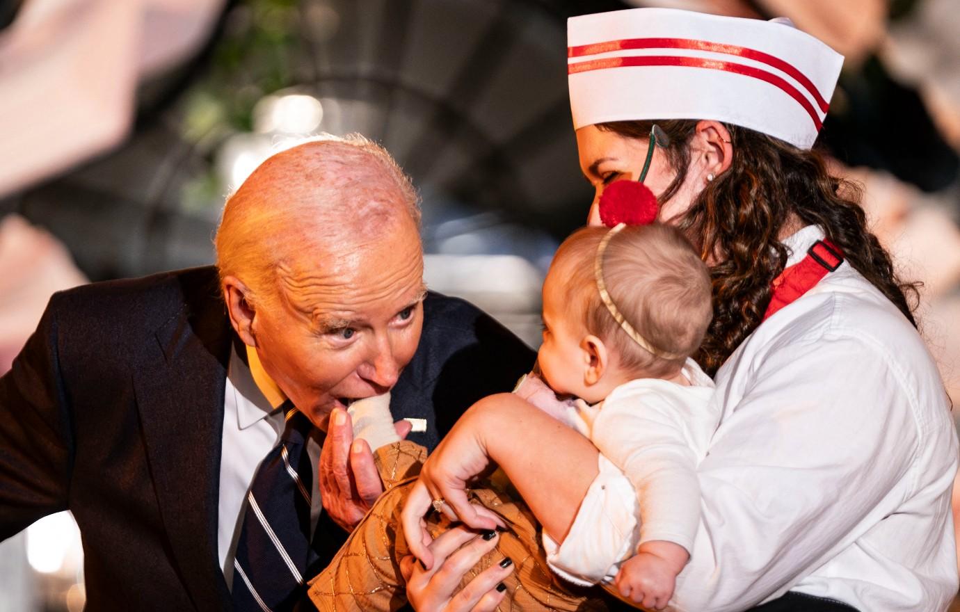 joe biden faces backlash pretending bite babies halloween creepy