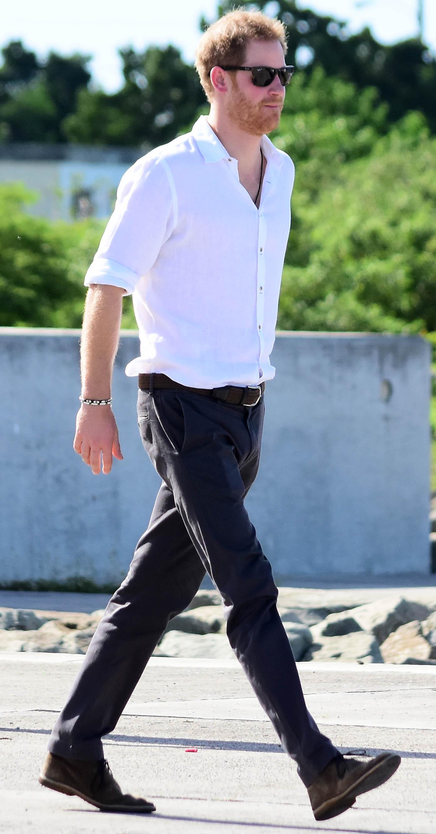 Prince Harry pictured boarding a boat in Barbuda to see the Frigate birds throughout the mangroves