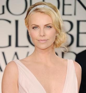 Charlize theron adopts march14nea.jpg