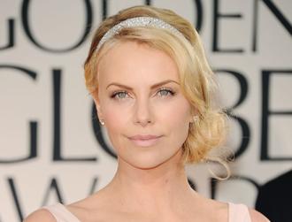 Charlize theron adopts march14nea.jpg