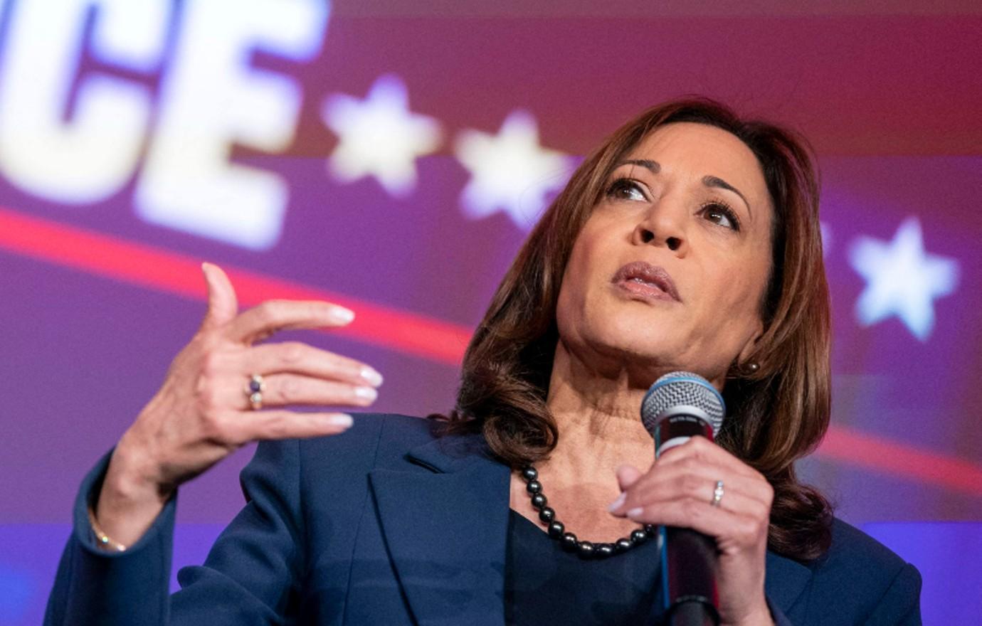 Photo of Kamala Harris in navy blue outfit.