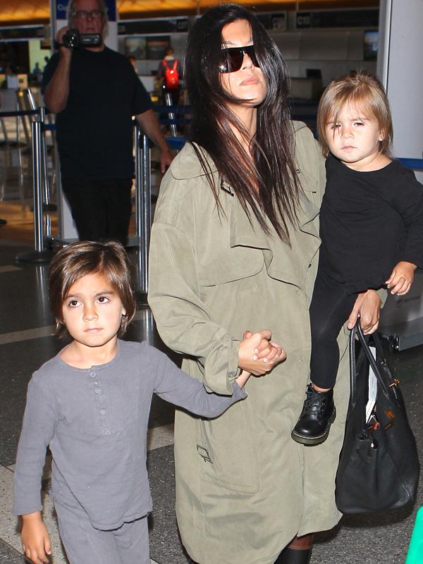 Kourtney Kardashian, Mason Disick and Penelope Disick fly out at LAX