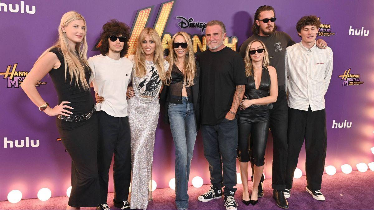 Image of Miley Cyrus was joined by mom Tish on the purple carpet.