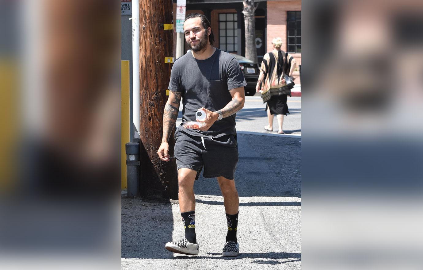 pete wentz with snacks and smiling