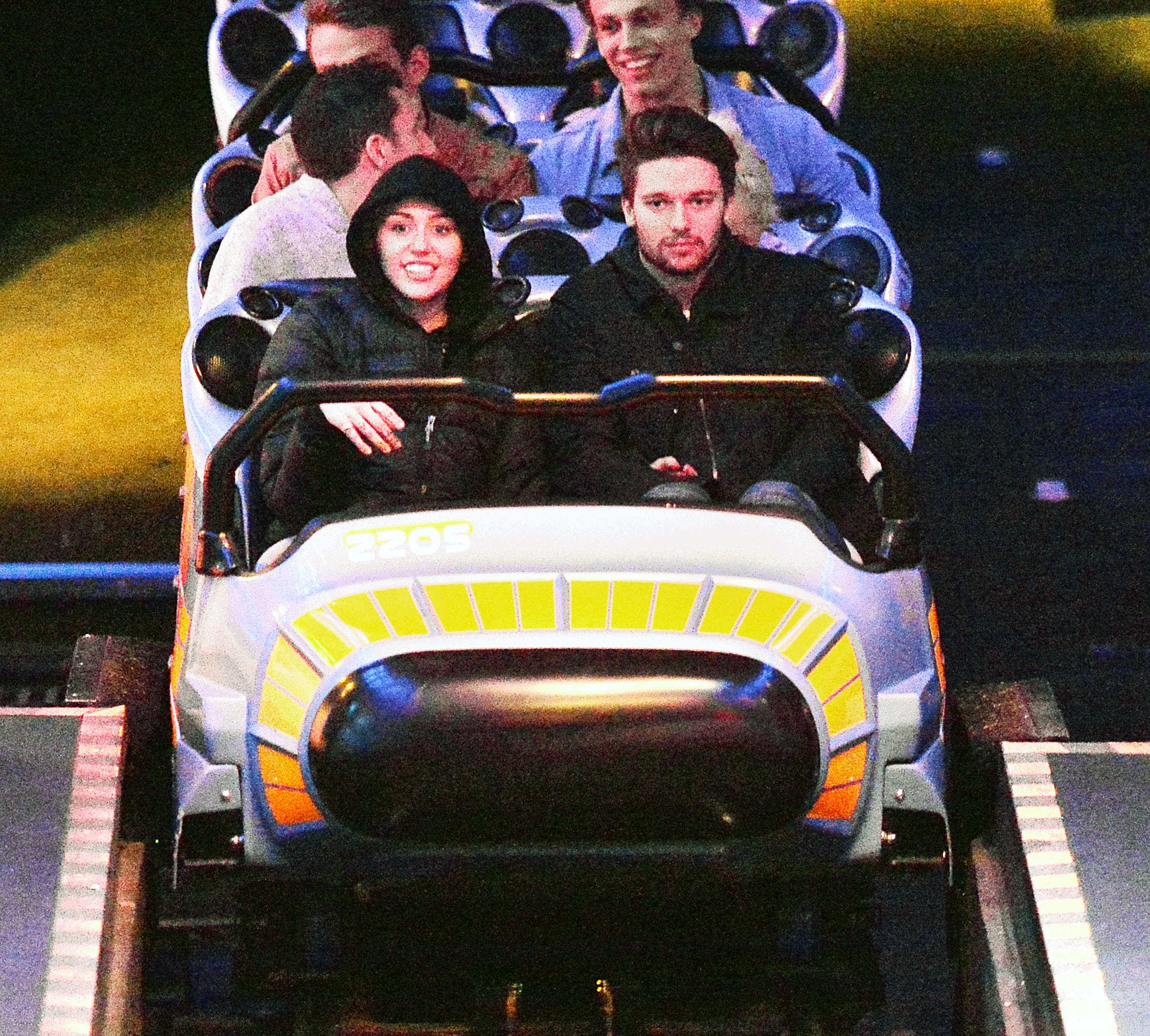 EXCLUSIVE: *PREMIUM RATES APPLY*NO WEB* Miley Cyrus and boyfriend Patrick Schwarzenegger enjoy a date night at Disneyland in Anaheim, CA.