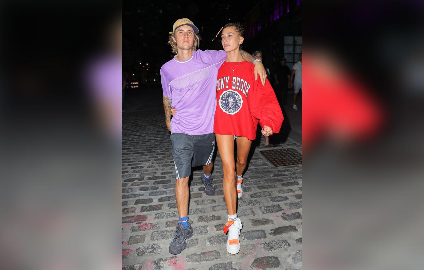 Justin Bieber wraps arm around Hailey Baldwin while they were leaving the Movie Theatre on Thursday night in New York City